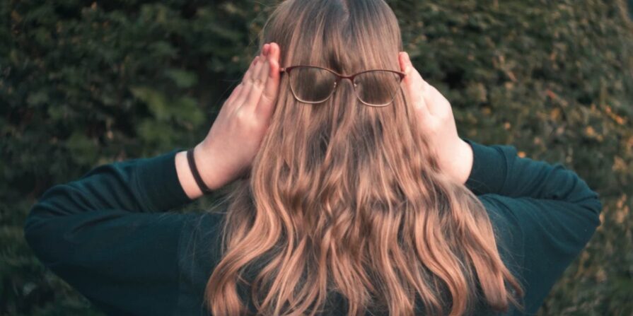 person with hair covering face