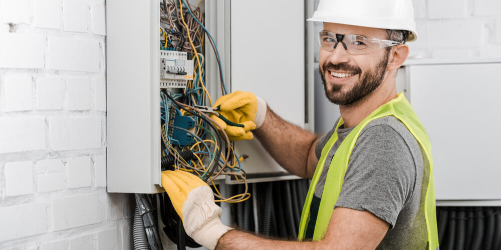 electrician-working-on-electrical-panel-circuit-breaker-box (1)